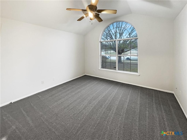 carpeted empty room with ceiling fan and lofted ceiling