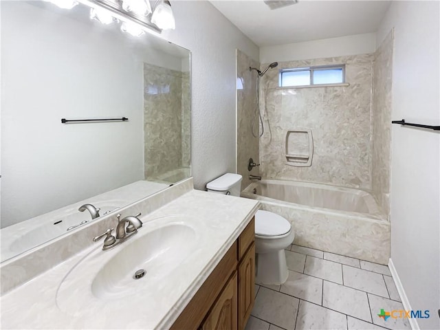 full bathroom featuring tile patterned flooring, vanity, tiled shower / bath combo, and toilet