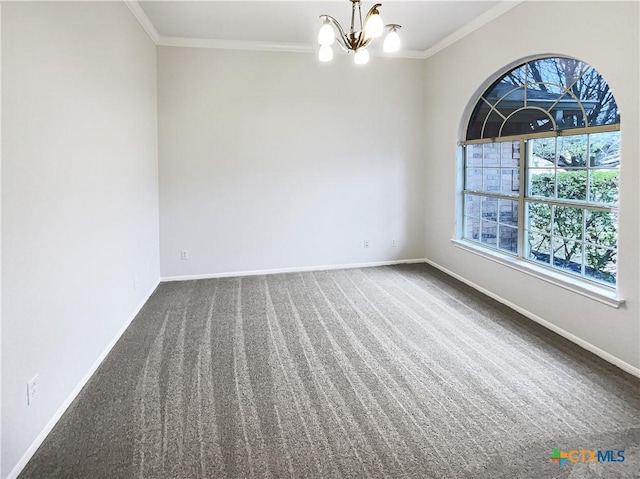 carpeted empty room with crown molding and an inviting chandelier