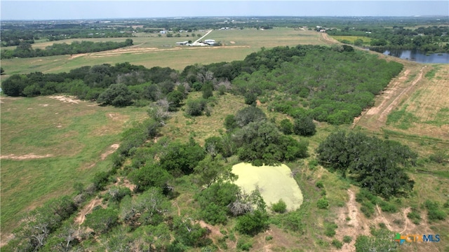 birds eye view of property with a rural view and a water view