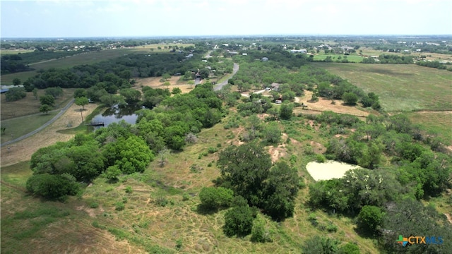 drone / aerial view with a water view and a rural view