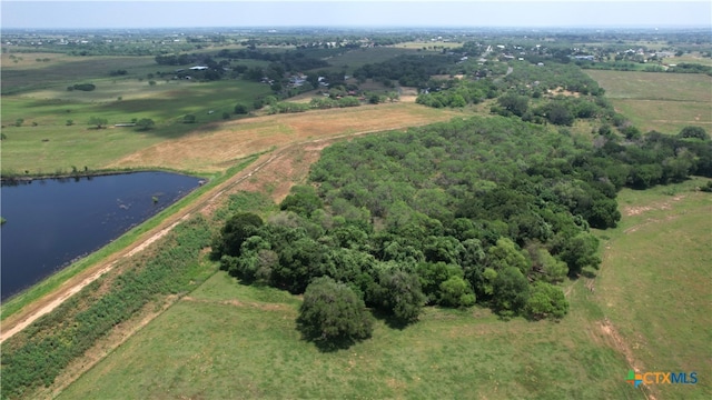 bird's eye view with a water view and a rural view