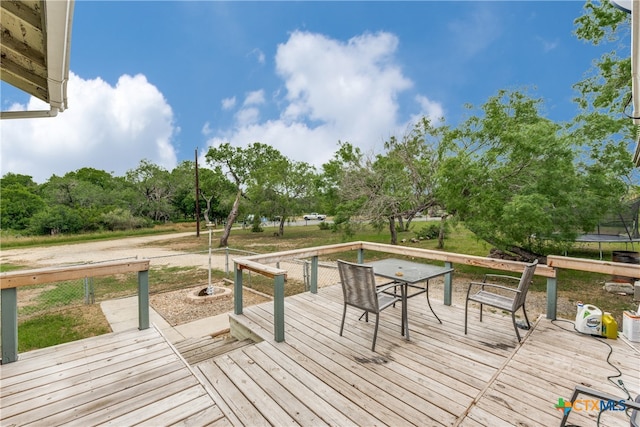 wooden terrace featuring a trampoline