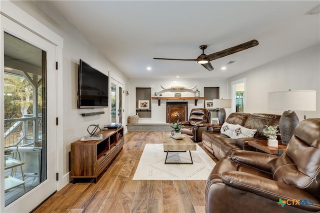 living room featuring ceiling fan