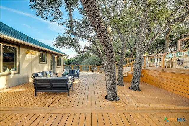 wooden deck featuring outdoor lounge area