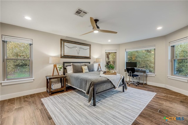 bedroom with ceiling fan and wood-type flooring