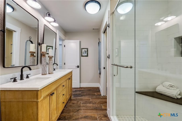 bathroom with vanity and an enclosed shower