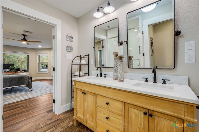 bathroom featuring ceiling fan and vanity