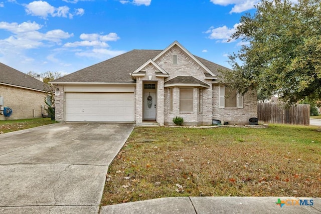 view of front of house with a garage and a front yard