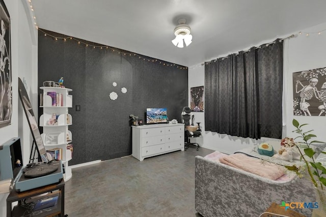 bedroom featuring concrete flooring