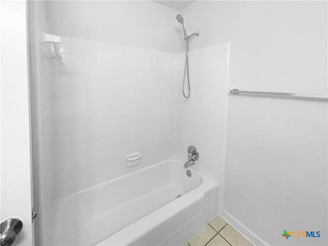 bathroom featuring tile patterned flooring and shower / tub combination