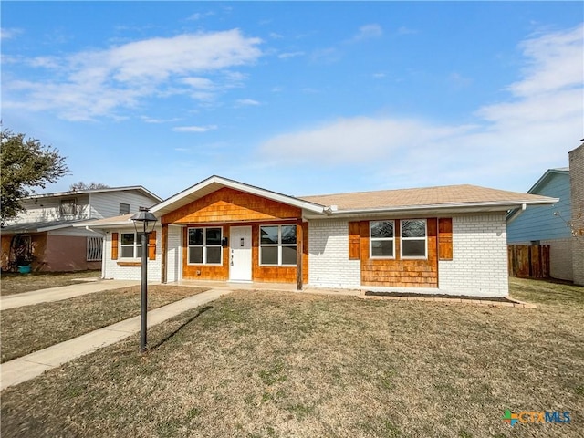 single story home with a front yard