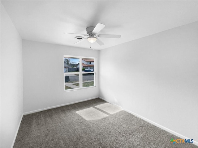 carpeted empty room with ceiling fan