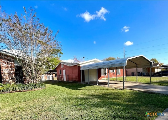 exterior space with a yard and a carport