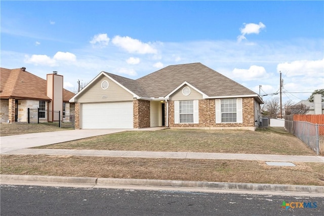 view of front of property featuring cooling unit, a front yard, and a garage