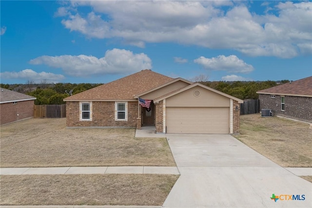 ranch-style home with a garage and cooling unit