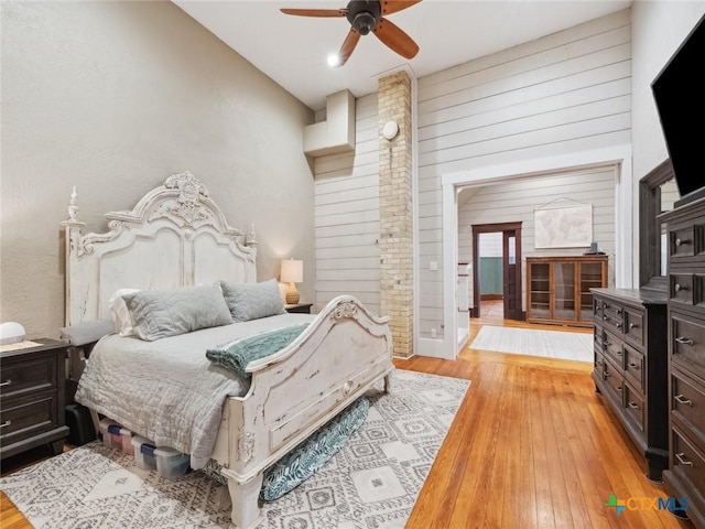 bedroom with ceiling fan and light wood-type flooring