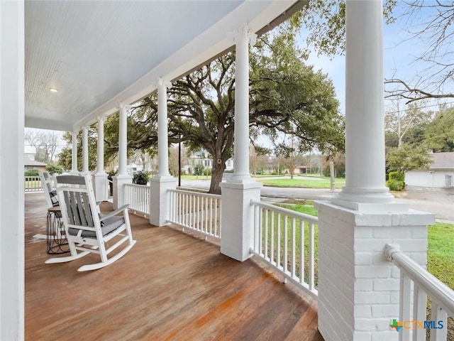 wooden terrace featuring a porch