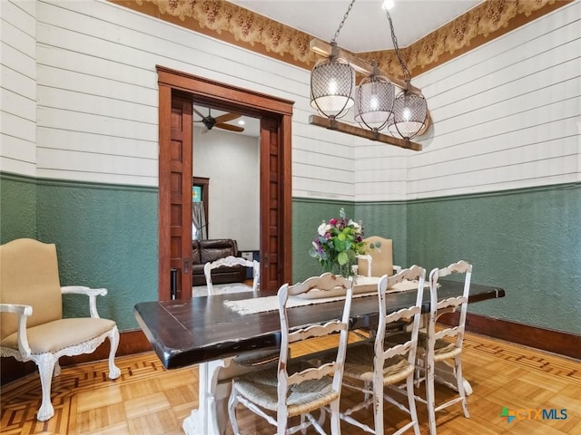 dining room featuring parquet floors