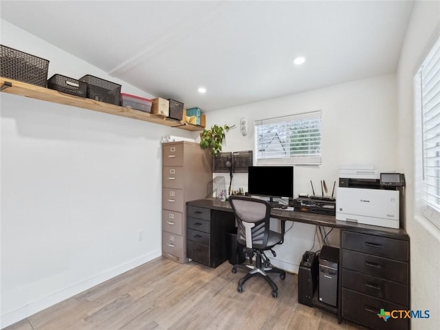 office space with light hardwood / wood-style floors