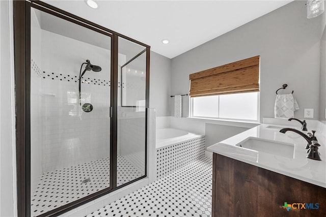 4130 Cripple Creek Dr, Temple, TX 76502 - bathroom with a bath, a shower stall, double vanity, and recessed lighting