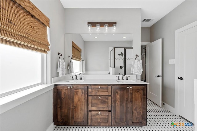 4130 Cripple Creek Dr, Temple, TX 76502 - bathroom with a stall shower, double vanity, and tile patterned floors