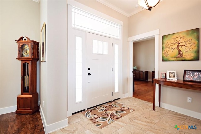 entryway featuring ornamental molding