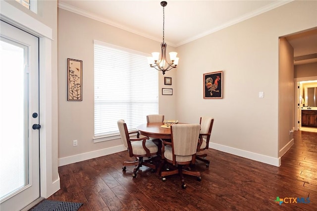 dining area featuring a notable chandelier, crown molding, and dark wood-type flooring