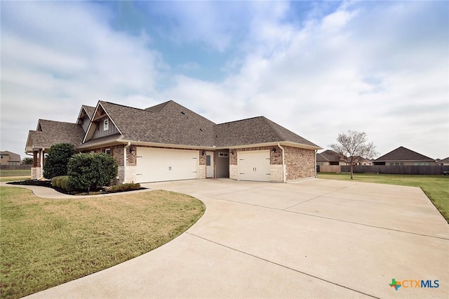 view of front of house featuring a garage and a front yard