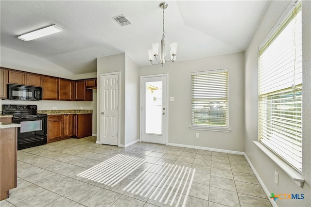 kitchen featuring vaulted ceiling, black appliances, a notable chandelier, hanging light fixtures, and light tile patterned flooring