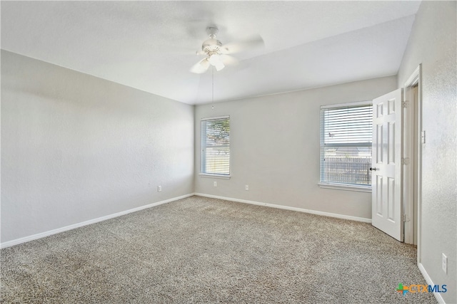 unfurnished room featuring carpet floors and ceiling fan