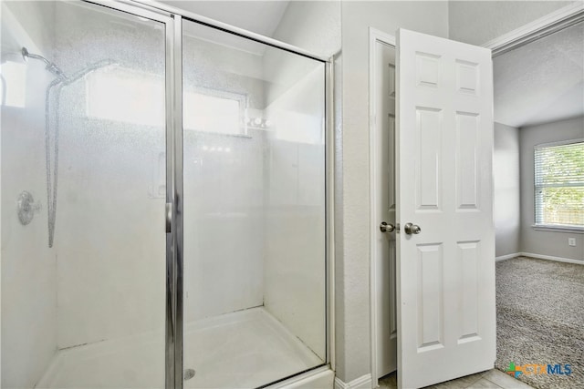 bathroom with a shower with shower door