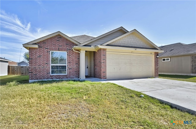 view of front of home with a front yard and a garage