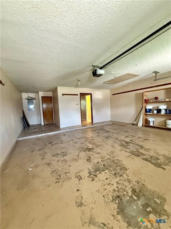 3002 Lois Cir, Copperas Cove, TX 76522 - garage featuring baseboards and a garage door opener