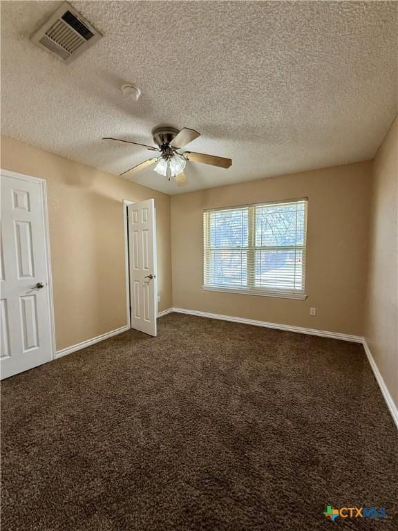 3002 Lois Cir, Copperas Cove, TX 76522 - empty room with a ceiling fan, a textured ceiling, dark carpet, and a smoke detector