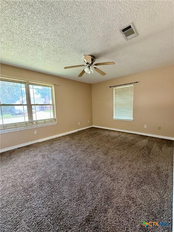 3002 Lois Cir, Copperas Cove, TX 76522 - carpeted spare room featuring a ceiling fan and a textured ceiling