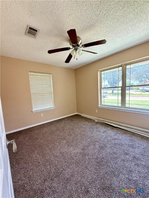3002 Lois Cir, Copperas Cove, TX 76522 - carpeted spare room featuring ceiling fan and a textured ceiling