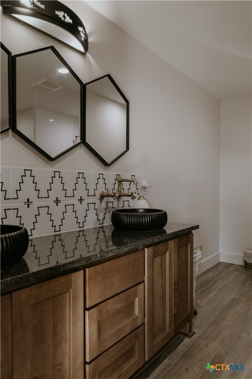 bathroom with wood-type flooring and vanity