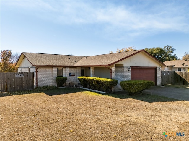 ranch-style house featuring a garage