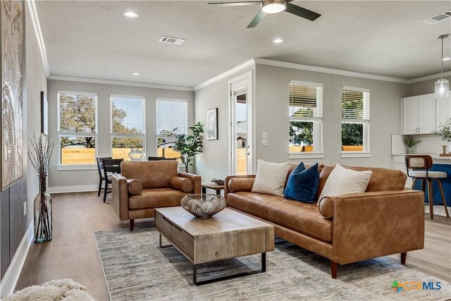 kitchen featuring pendant lighting, sink, stainless steel appliances, and light hardwood / wood-style floors