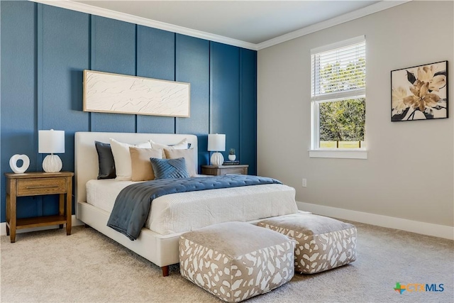 carpeted bedroom with crown molding and baseboards