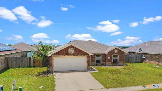 1212 Trailboss Dr, Killeen, TX 76549 - view of front facade with concrete driveway, a garage, and brick siding