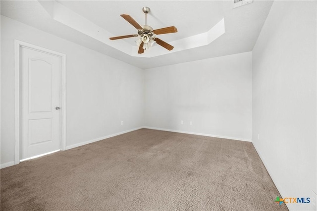 1212 Trailboss Dr, Killeen, TX 76549 - carpeted empty room featuring a tray ceiling and a ceiling fan