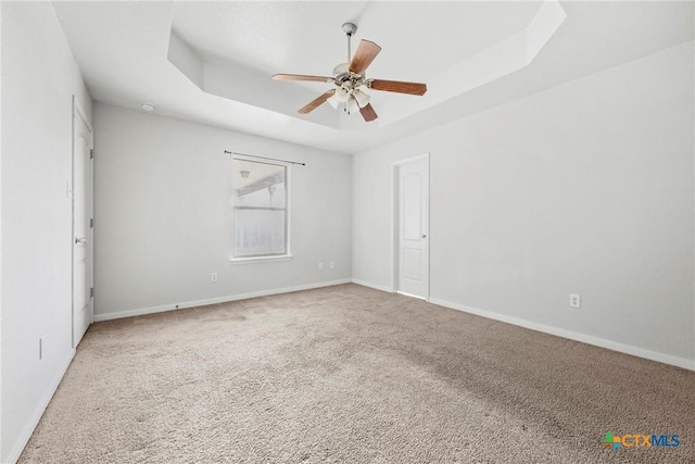 1212 Trailboss Dr, Killeen, TX 76549 - carpeted spare room with a raised ceiling and a ceiling fan