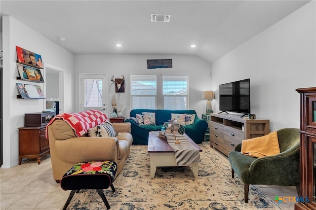 tiled living room featuring lofted ceiling