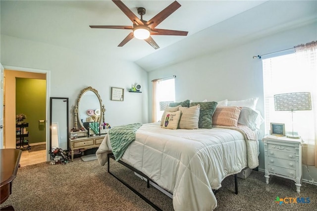 carpeted bedroom featuring vaulted ceiling and ceiling fan