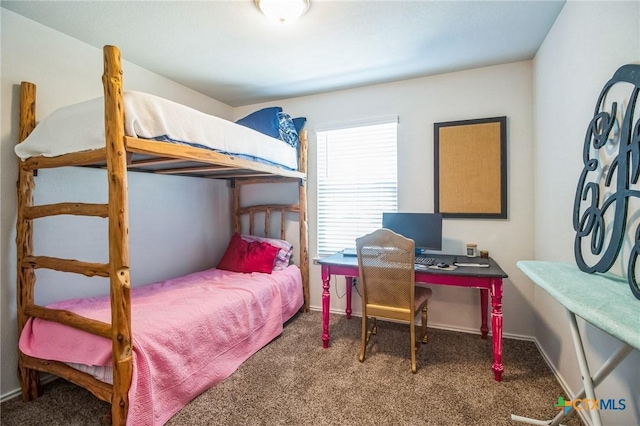 bedroom featuring dark colored carpet