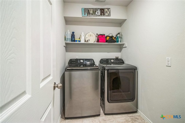 laundry area with washer and clothes dryer