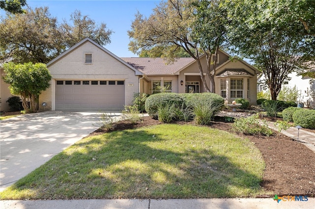 ranch-style home with a garage and a front yard