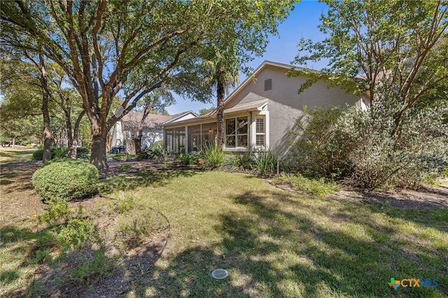 view of yard featuring a sunroom